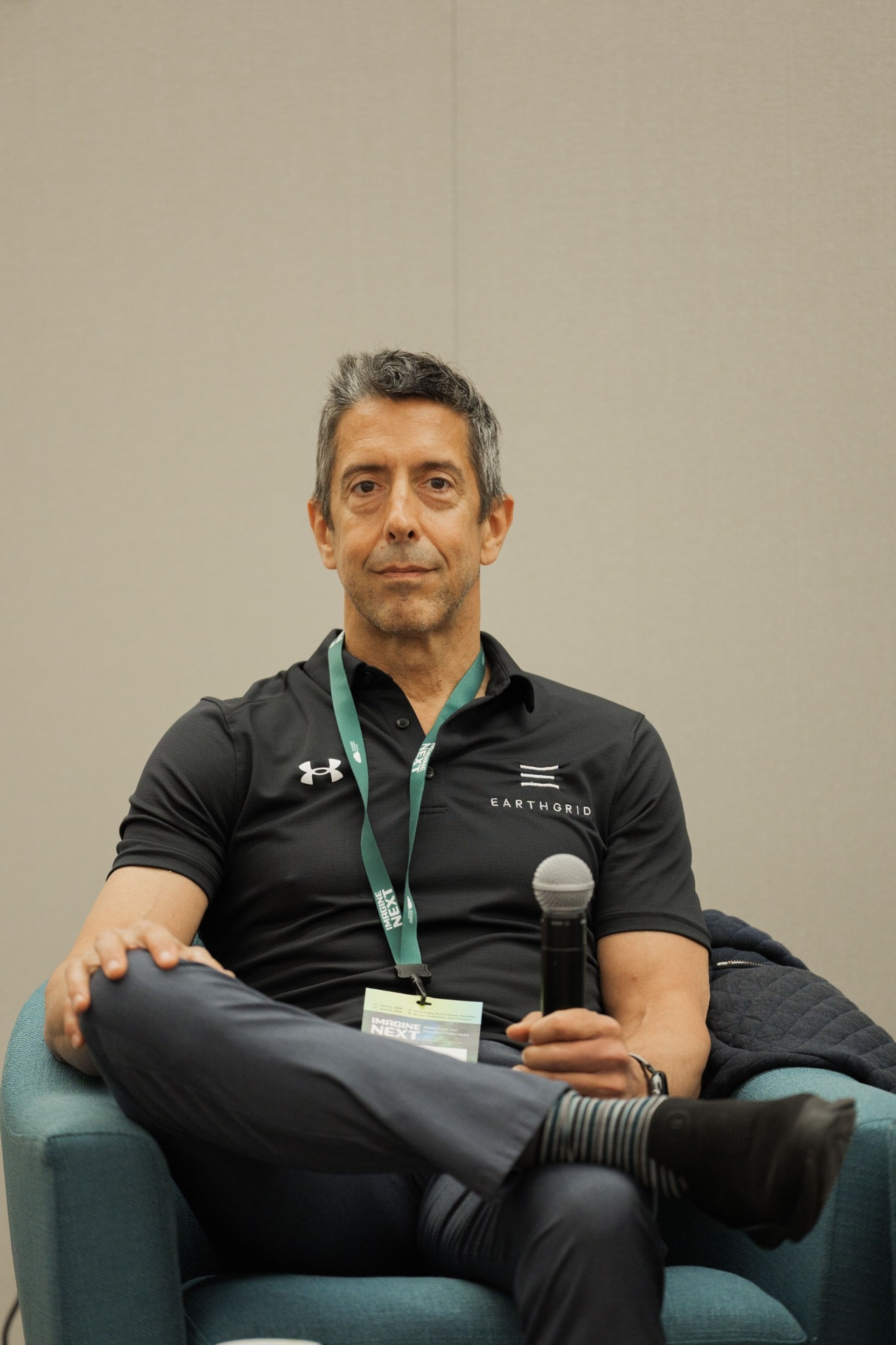 Portrait of the Earthgrid founder seated on the Capital Day founders panel