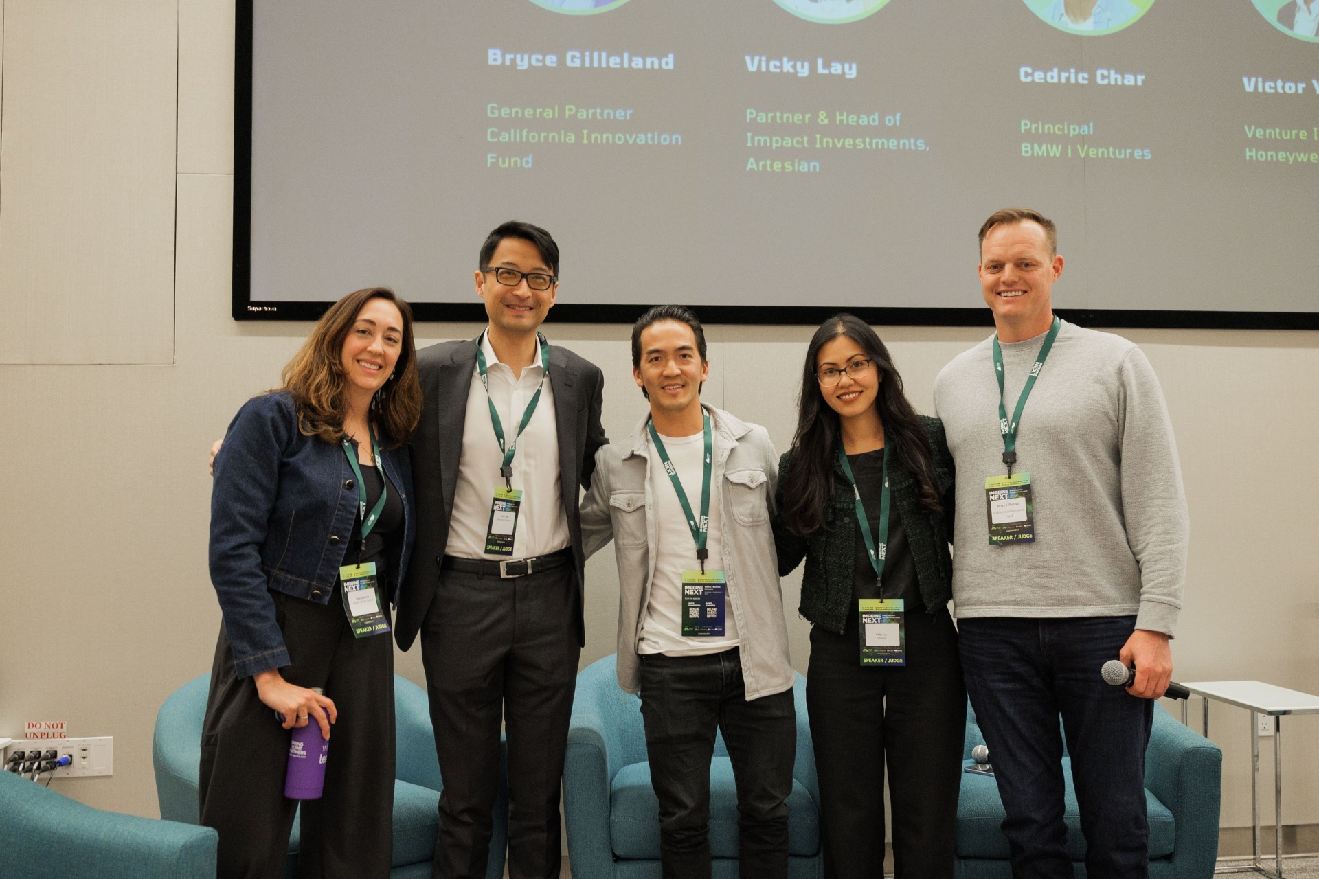 Capital Day VC panel group photo — Shayna Harris, Victor Yang, Cedric Char, Vicky Lay and Bryce Gilleland on stage at UC Law SF beneath the speaker line-up slide