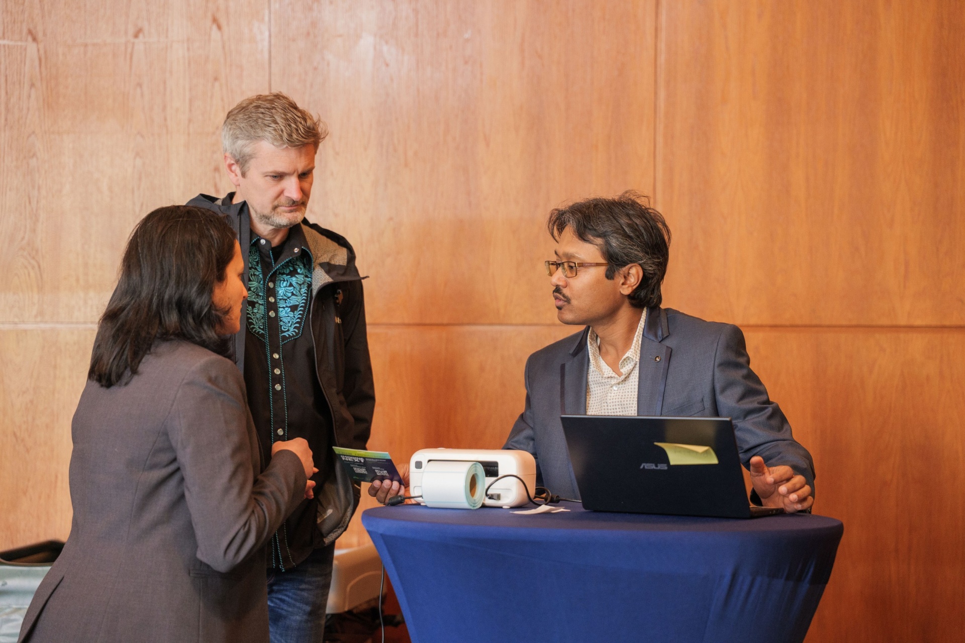 Founder pitching to delegates at the demo table