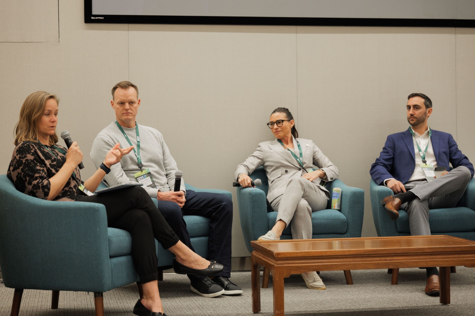 Capital Day Panel 5 'From Growth to Bankability' wide shot — Christina Cairns moderating with Bryce Gilleland, Dr. Tobi Ann Petrocelli of Arup and Daniel Baruch of J.P. Morgan listening on stage at UC Law SF