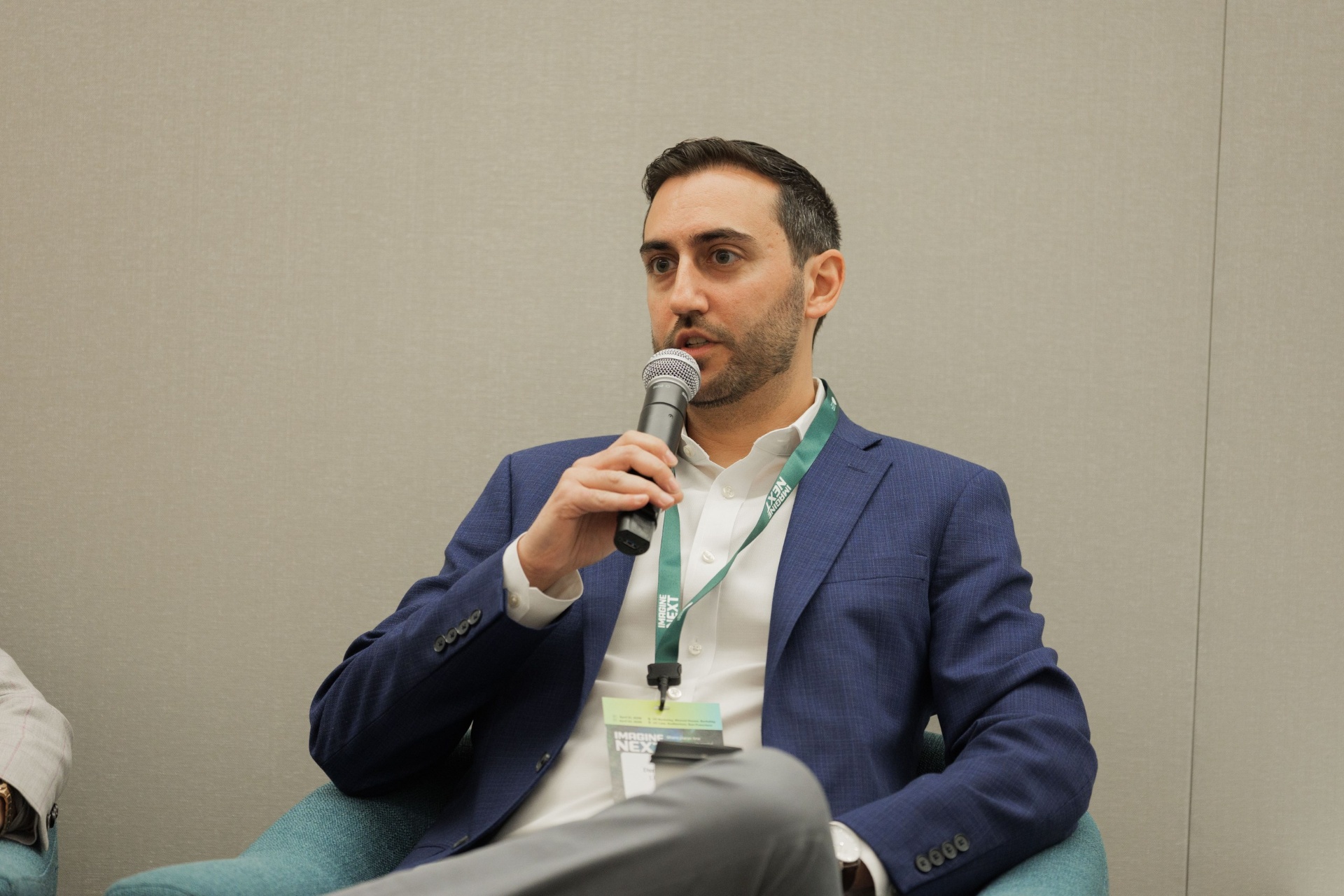 Daniel Baruch of J.P. Morgan ClimateTech Investments & Innovation speaking with mic during Capital Day Panel 5 'From Growth to Bankability' at UC Law SF