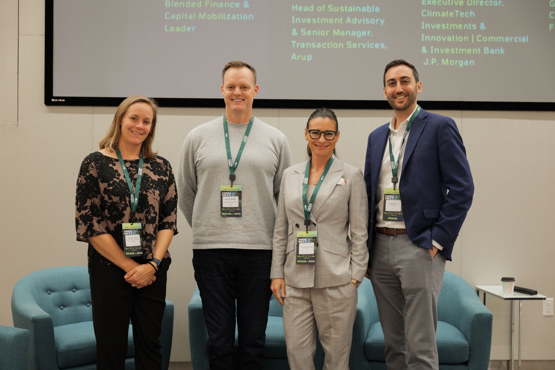 Capital Day Panel 5 group photo with Christina Cairns, Bryce Gilleland, Dr. Tobi Ann Petrocelli and Daniel Baruch standing beneath the 'From Growth to Bankability' speaker slide at UC Law SF