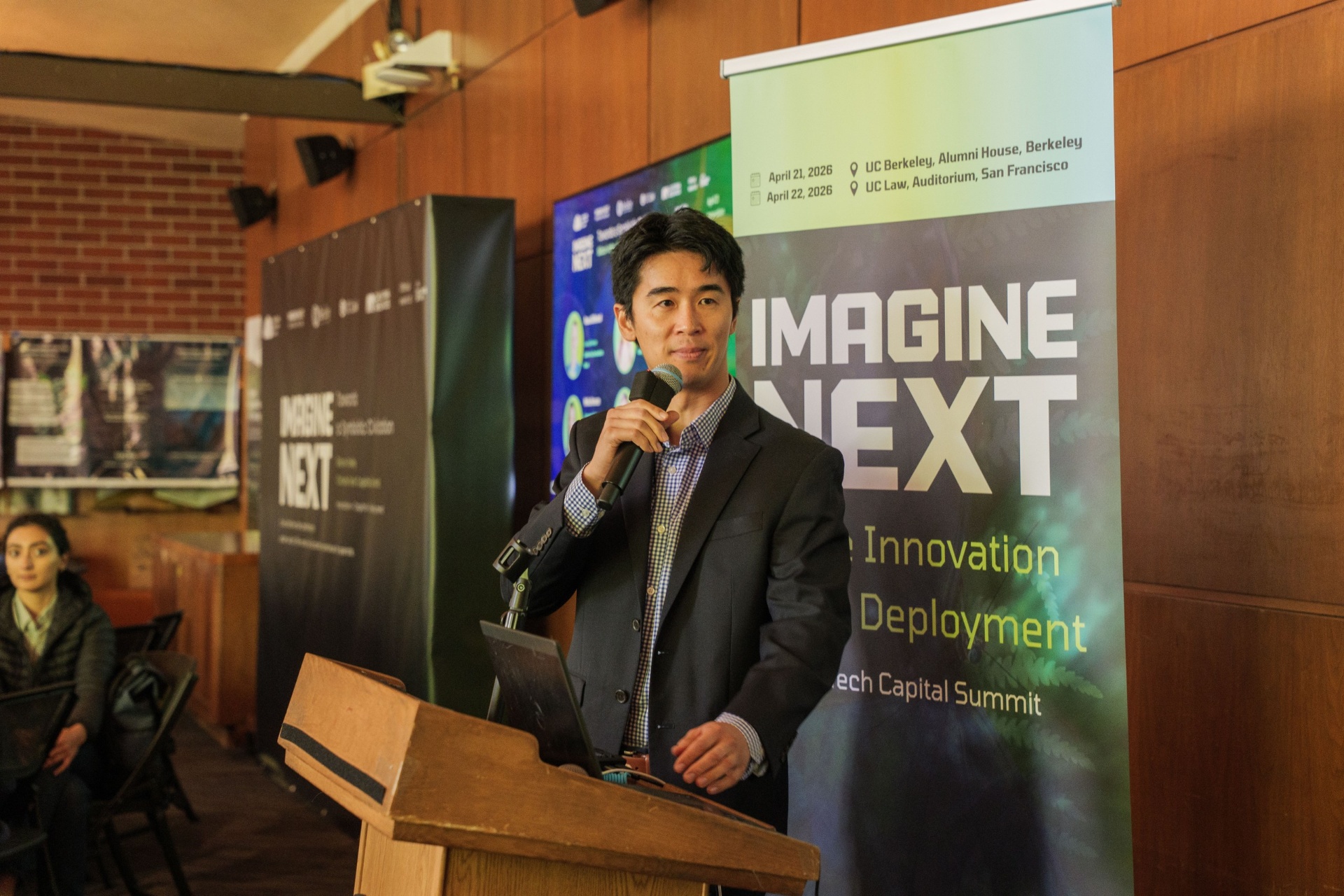 Pitch presentation with Imagine Next banner backdrop