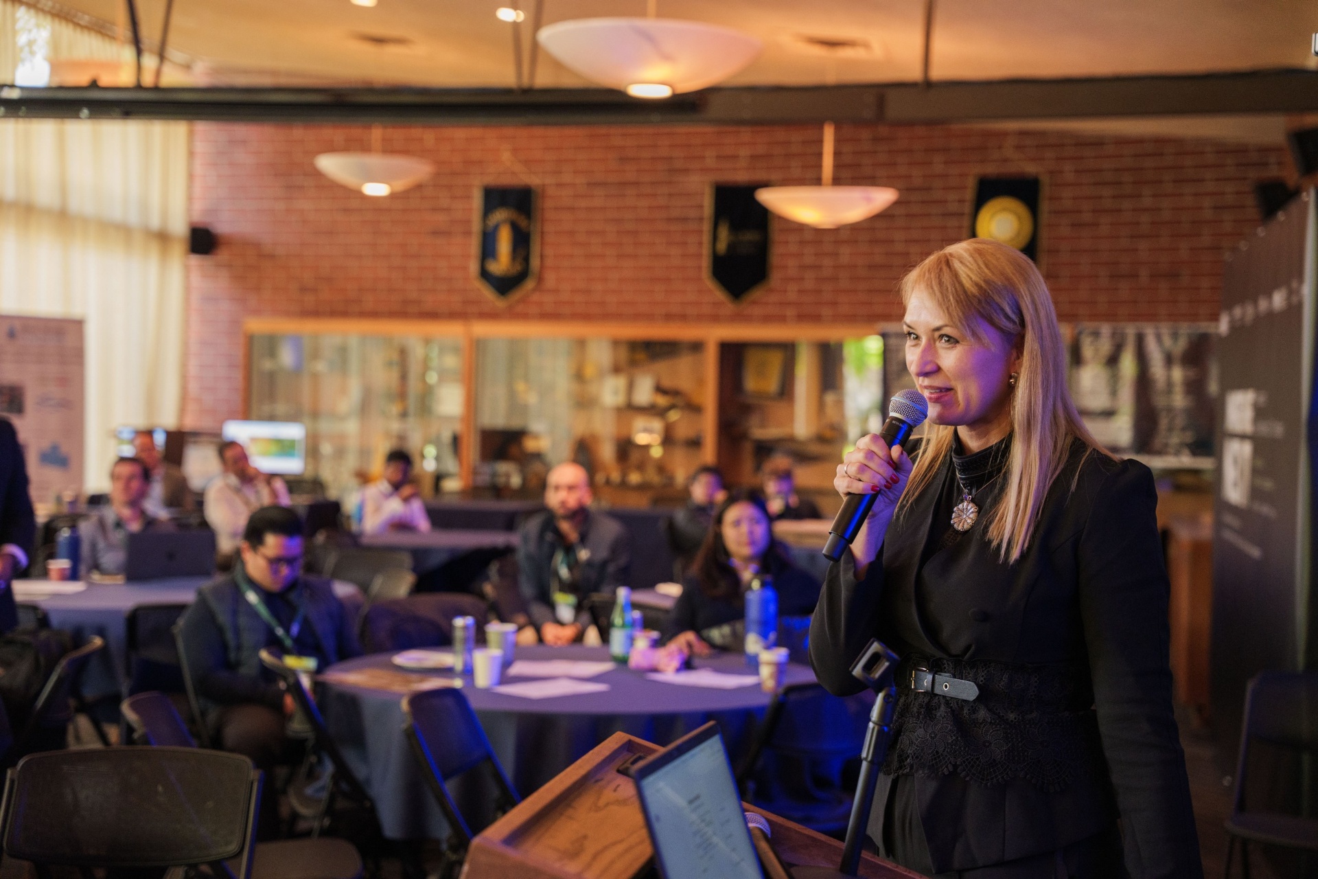 Host addressing the audience at UC Berkeley Alumni House