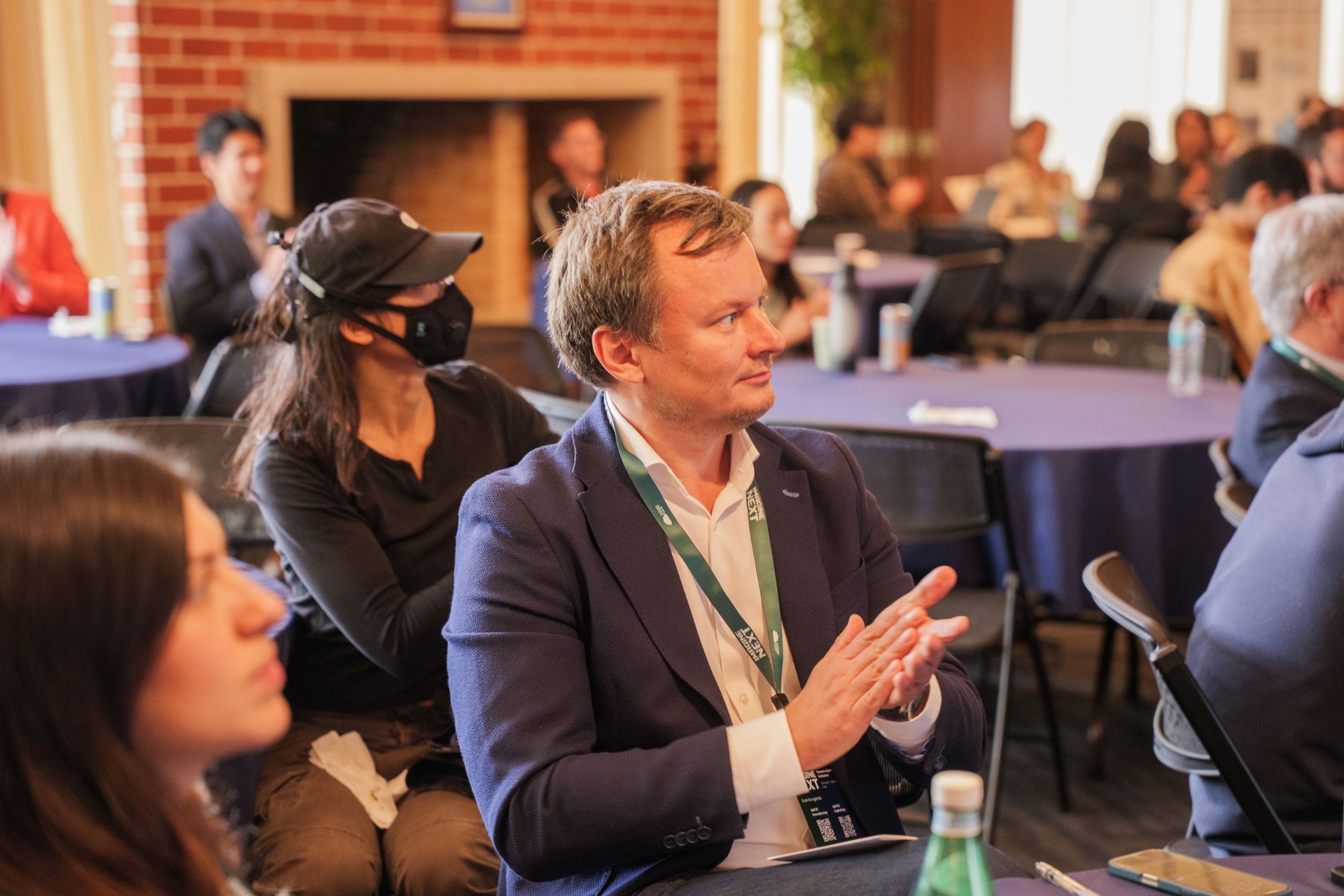 Delegate applauding during a pitch session