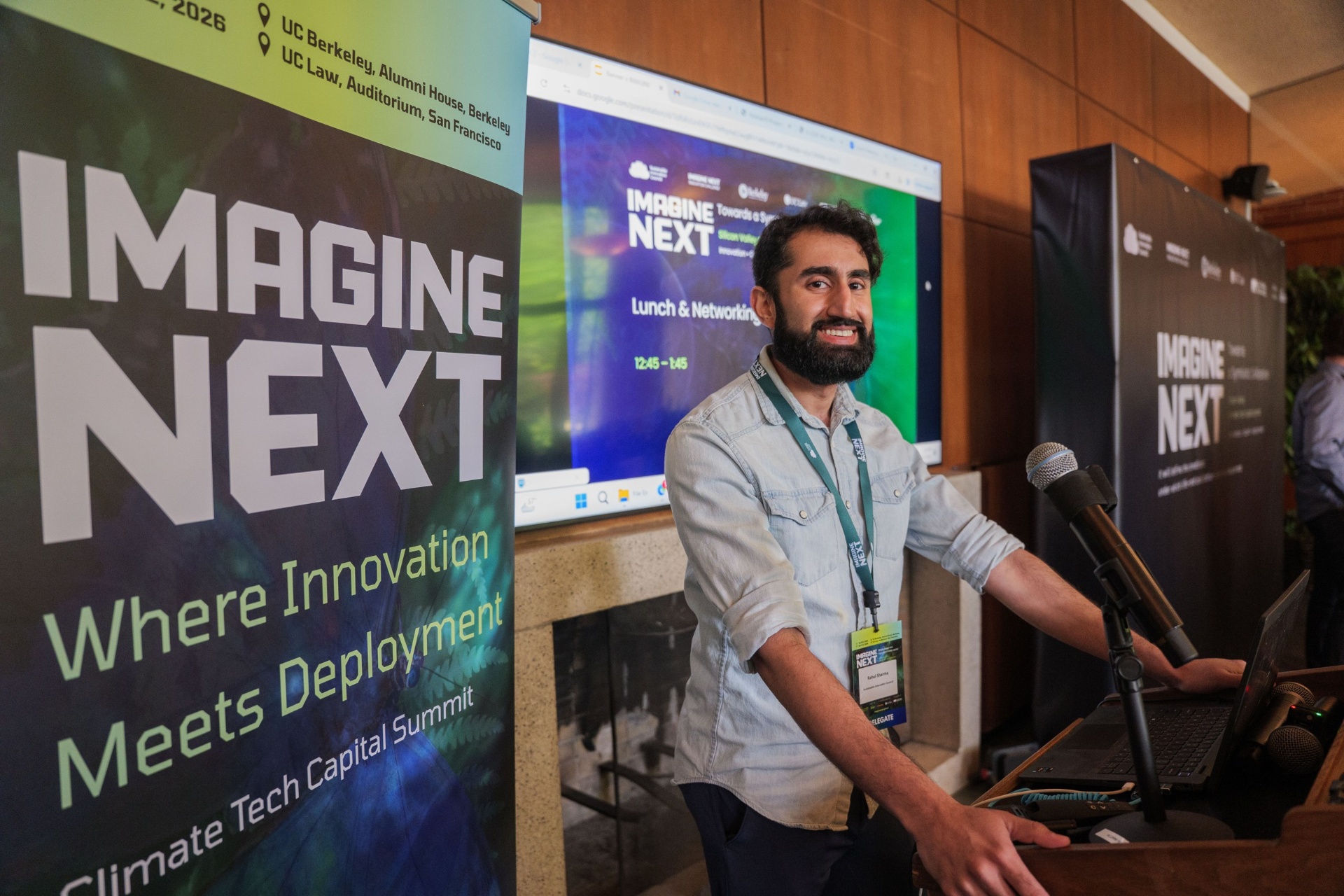 Rahul Sharma at the podium during Lunch & Networking transition
